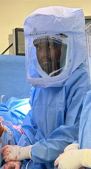 Dr Sumesh Subramanian in protective suit during knee replacement surgery